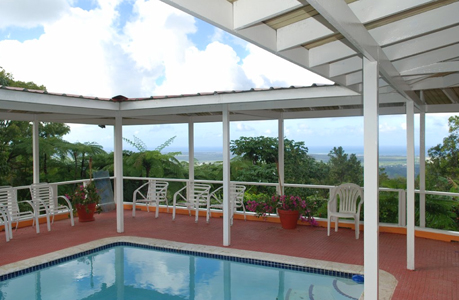 pool area with covered deck at the villa rental